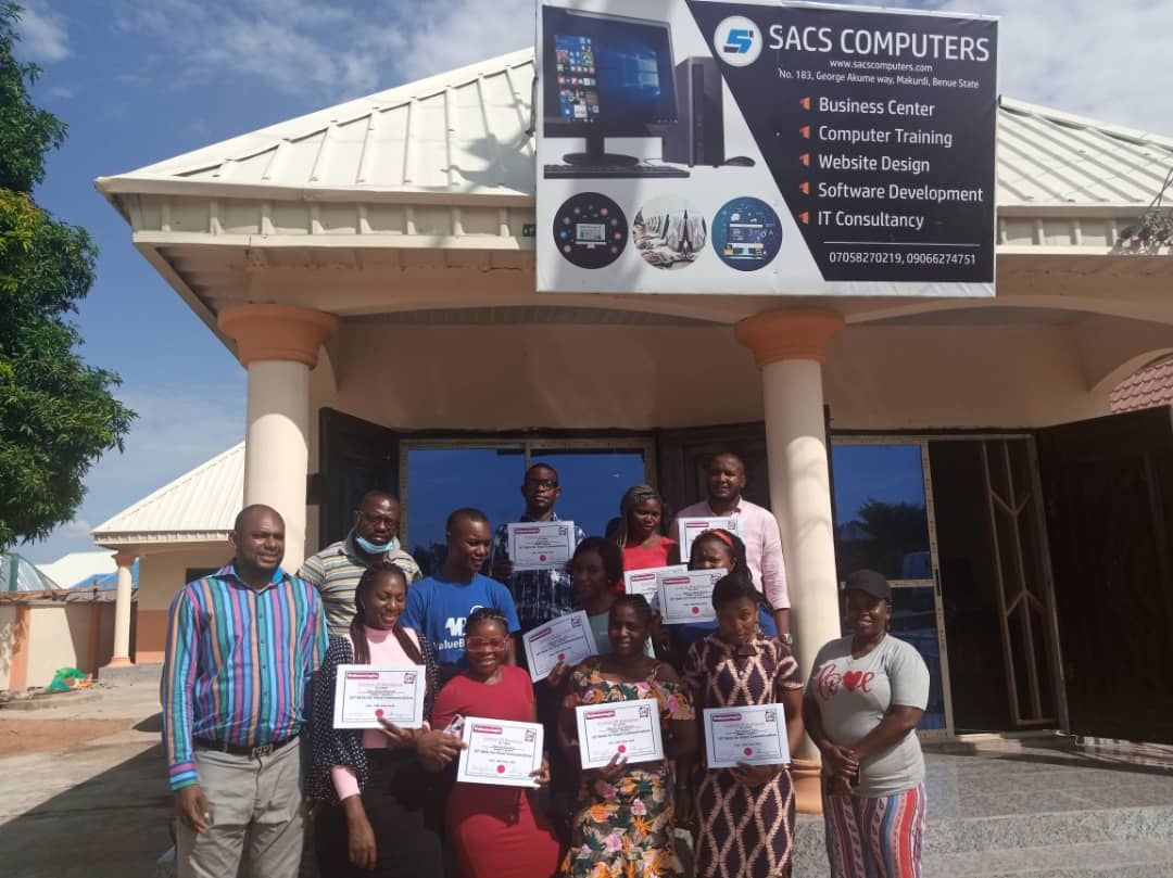 Trainees with their certificates outside the SACS Computers Training Center